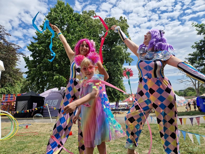 Six-year-old Ella Watts has a great time ribbon twirling with some of the excellent performers at Into the Trees 