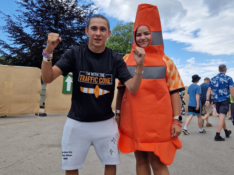 A traffic cone and traffic warden get into the festival spirit 