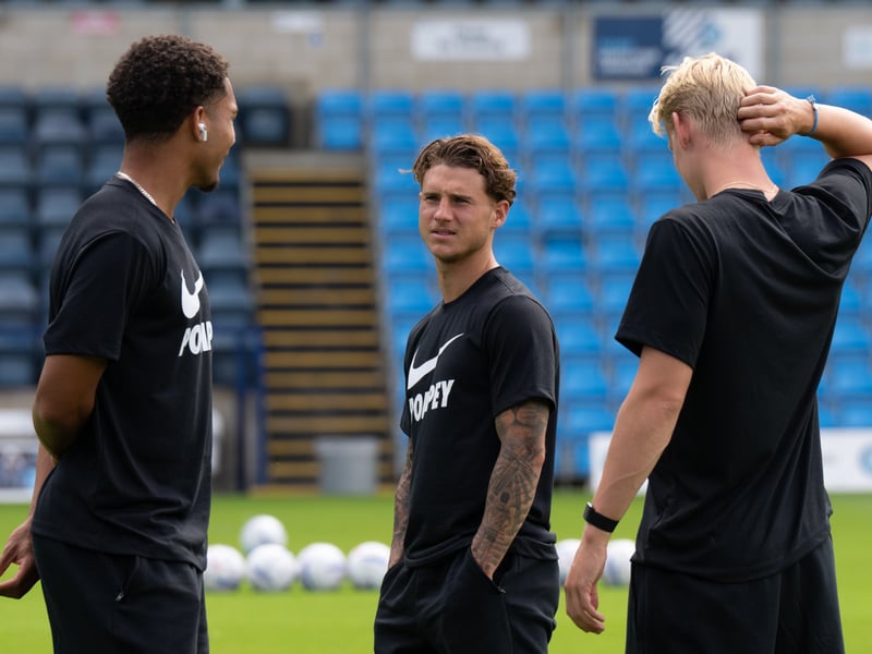Adrian Segecic chats to Ibane Bowat and Rocco Shein before the Wycombe game.