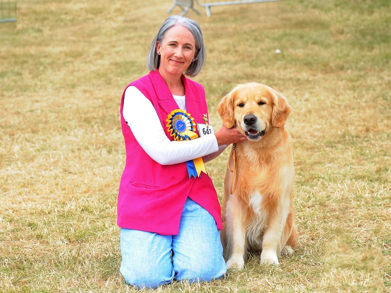 Liz Law of Scotland with her golden retriever, which won Best in Breed