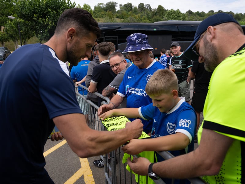 John Mousinho taking time to sign some shirts.