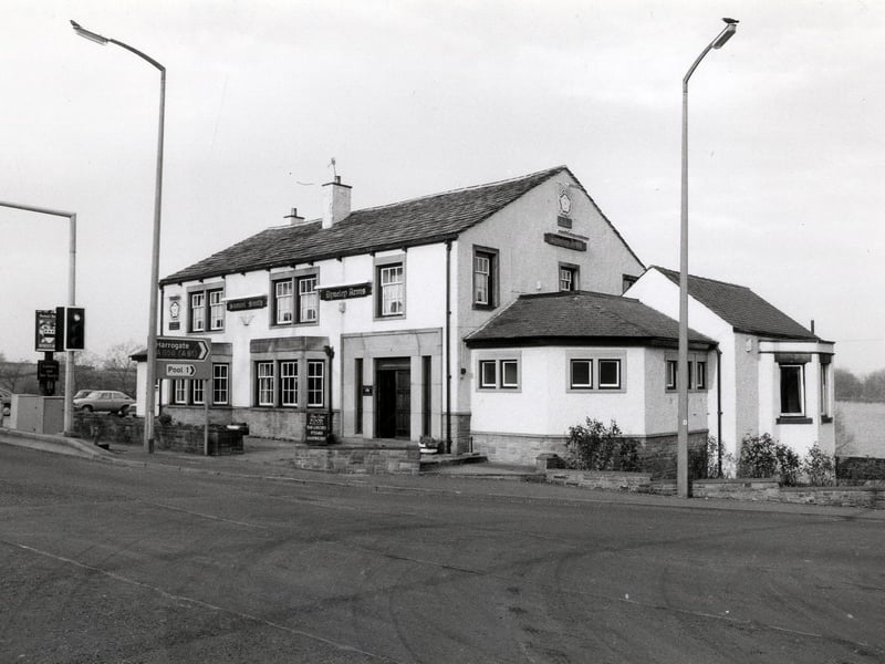 Dyneley Arms pub at the junction of Leeds Road and Pool Bank New Road. A pub has stood here since at least the mid 19th century but the original Dyneley Arms was replaced by this one at some point. The pub as seen here closed down in October 2002 after suffering severe damage in a fire.