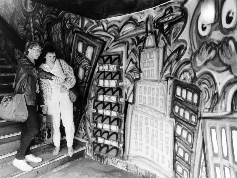 June 1986 and Carl Waite from Wakefield and Andrea Bailey from Tingley admire the mural at Leeds City Station..