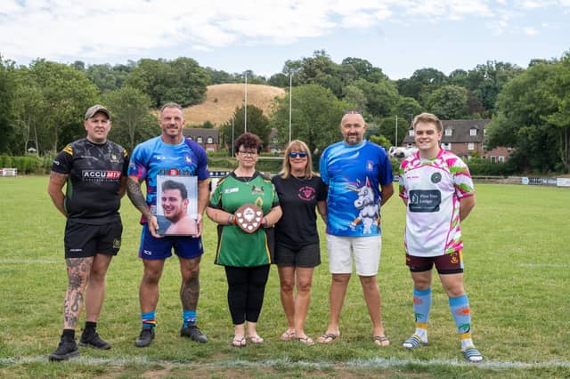 Mandy Oliver, third from left, with team captains and representatives at the rugby day in memory of her son, Will Rogers