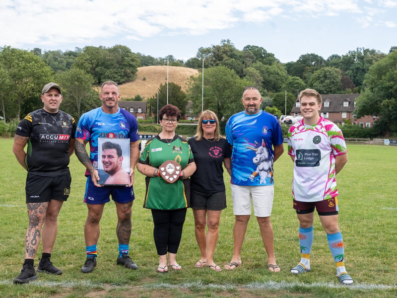 Mandy Oliver, third from left, with team captains and representatives at the rugby day in memory of her son, Will Rogers