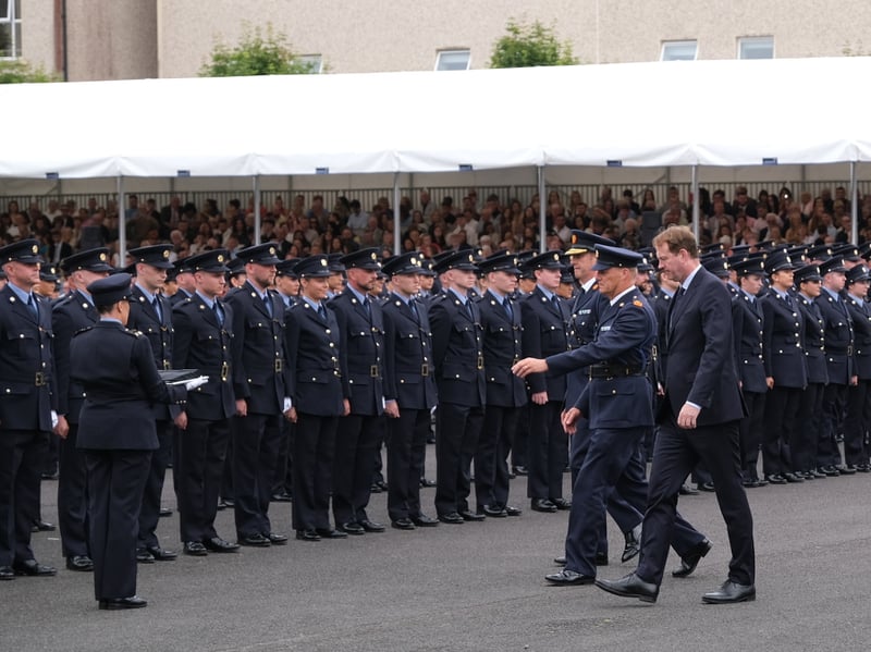 Garda Commissioner Justin Kelly and Minister for Justice Jim O'Callaghan presenting the new recruits.