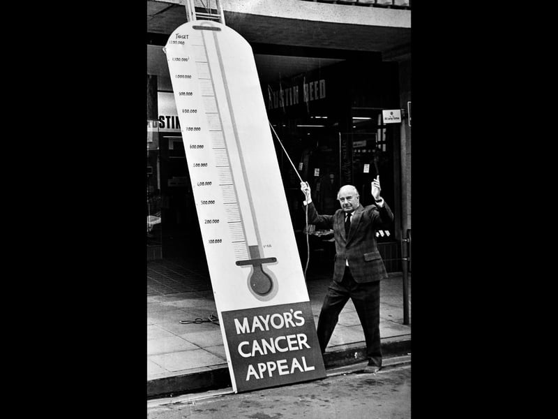 Mayor Councillor Bernard Lingen hoists the rope on a towering 13 foot fundraising thermometer in The Square on August 6, 1979, officially launching an ambitious community push to raise £1.25 million for a brand new cobalt cancer treatment unit at the Royal Shrewsbury Hospital. Did you pop loose change into the collection tins or hold a fundraising event for the mayor's cancer appeal that year? Do you remember seeing the huge thermometer standing outside the shops in The Square tracking the town's generosity?