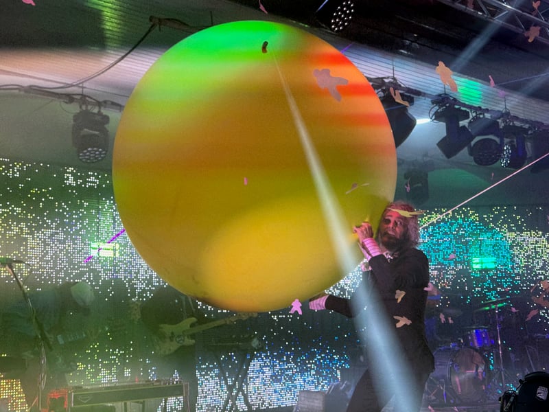 As it traditional at Flaming Lips shows, there were plenty of huge balloons filled with confetti designed to burst over the crowd.