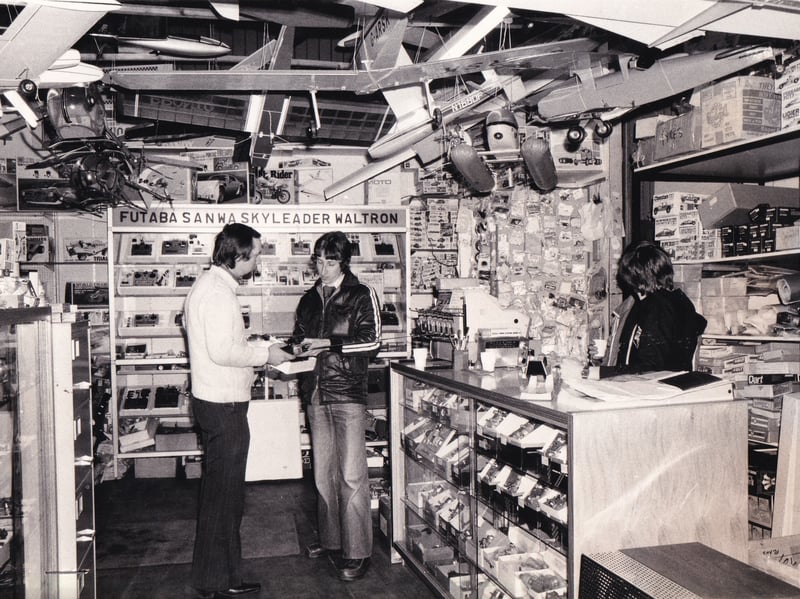 Brian Stockton discusses a radio control device with a customer in the Morley Models shop in March 1980.