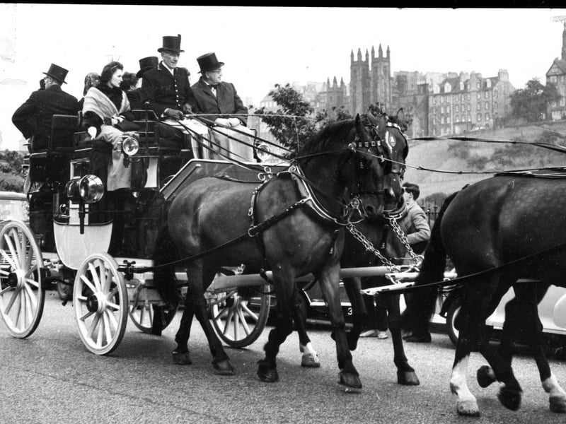 Lord Provost Sir John G Dunbar and Lady Provost forsook their gleaming Rolls Royce to travel in this handsome Gilby coach-and-four horse drawn carriage from the City Chambers to Murrayfield ice rink where they attended the opening performance of 'The Four Sons of Aymon' at the 1962 Edinburgh Festival.