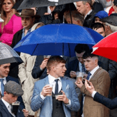 Galway Races punters protected from the rain