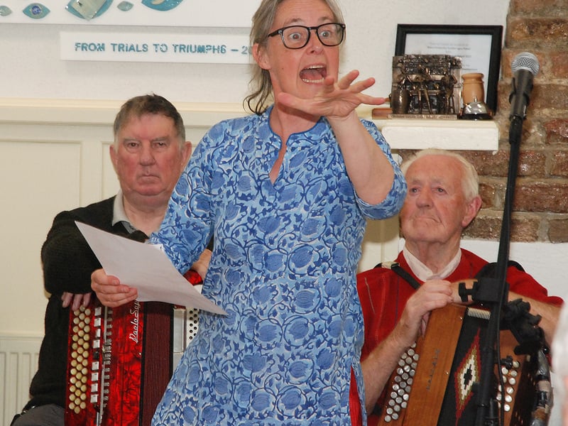 Fiona Bolger (Poet) with John Pardy and Mick Ryan in the background. Photo: PJ Wright