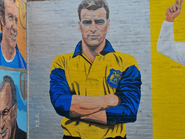 Artist Robert Endeacott  mural for the Leeds United themed car wash at Elland Road
