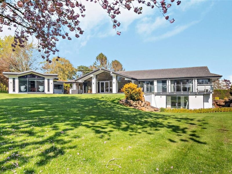 Five bedrooms, five bathrooms, 6,117 sq ft.