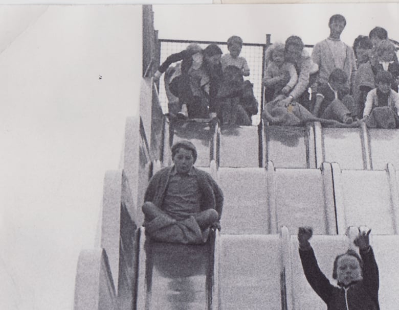 Youngsters hurtle down a huge slide on the promenade at Bridlington in July 1972