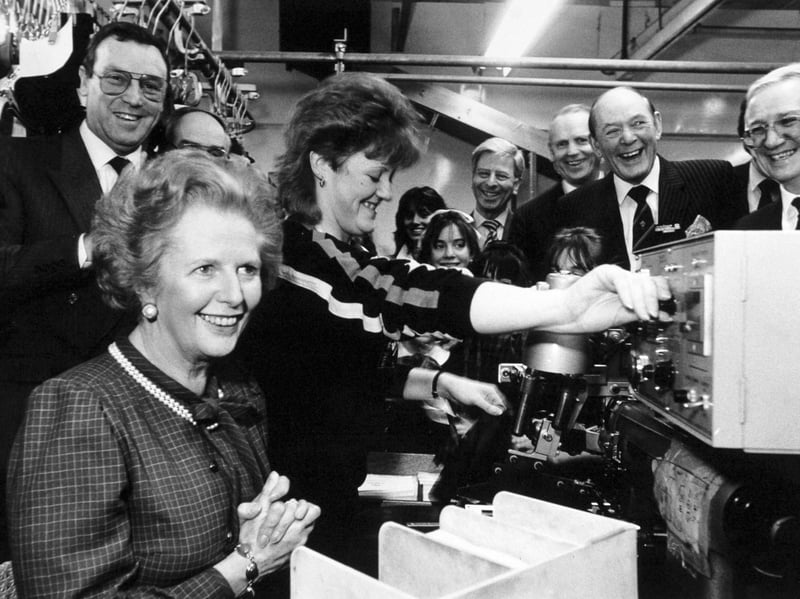 The Prime Minister was all smiles as she tried her talents at machining a pocket lining for a jacket during her visit to Centaur Clothes on Great George Street in  February 1987. Karen Pheasby who normally works on the machine shows how it's done. John Jackson, chairman and managing director of Centaur Clothes, is on the left.