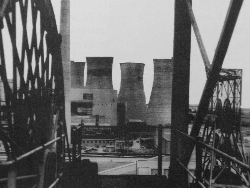 Framed by towering industrial steelwork, a dramatic view looks across Lea Hall Colliery in Rugeley circa 1962, with the giant cooling towers of Rugeley Power Station dominating the skyline behind. Opened in July 1960 as part of the post-war modernisation of the Cannock Chase Coalfield, Lea Hall was a pioneer of its time - the first pit in Britain designed to feed coal directly to an adjacent power station via conveyor belt. This impressive modern setup powered thousands of homes and industries across Staffordshire for decades before the colliery eventually closed its shafts in 1990. Did you or anyone in your family work down the pit at Lea Hall Colliery or at the neighbouring power station back in the day?