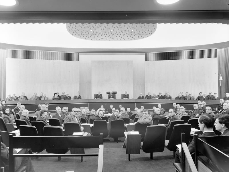 Shropshire county councillors gather for what is understood to be their very first official sitting in the newly completed council chamber at the Shirehall, Shrewsbury, on 12 November 1966. Snapped by veteran local photographer Bernard Cross, the historic image captures elected members settling into the futuristic, modern horseshoe seating layout. The impressive modern building represented a bold new chapter for local governance, replacing the old council premises in the heart of town with ultra-modern 1960s architecture. Do you remember when the new Shirehall opened in Abbey Foregate back in 1966, or did you ever attend a meeting in the council chamber?