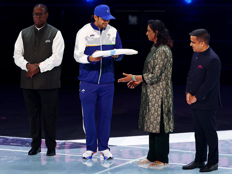 Neeraj Chopra of Team India passes the Commonwealth Sport flag to PT Usha, President, Commonwealth Games Association of India during the Closing Ceremony.