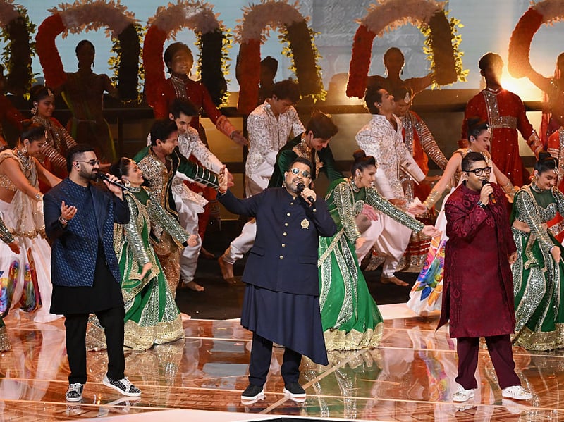 Shankar Mahadevan and his sons Siddharth and Shivam Mahadevan perform a medley during the Closing Ceremony.