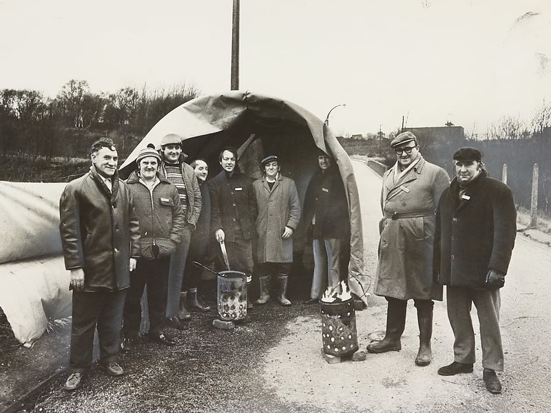 Pickets gather around braziers to keep warm outside the entrance to West Cannock No. 5 Pit, Hednesford, during the miners’ strike on February 11, 1974.