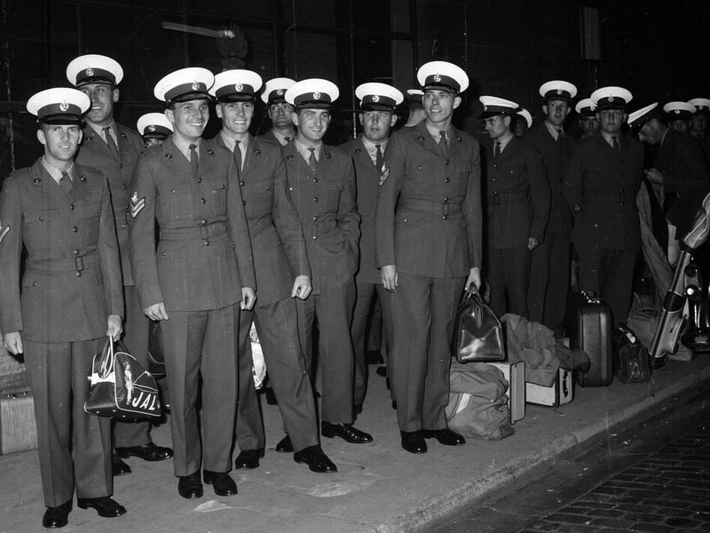 Members of the band of the Royal Marine School of Music drill squad arriving in Edinburgh for the Tattoo in 1961.