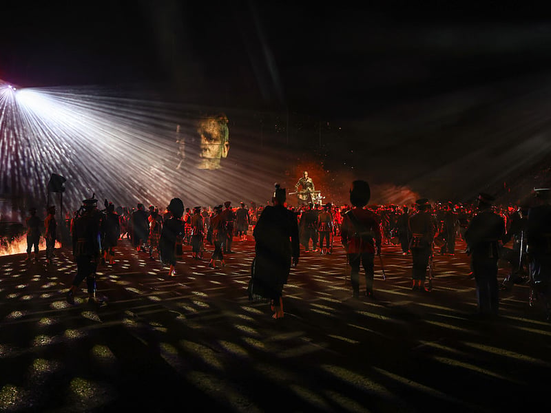 A mirrorball lights up the Tattoo performers.