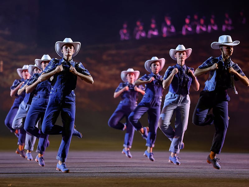 Dancers in stetson hats perform.