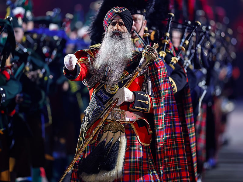 Leading the massed pipe bands and drums.