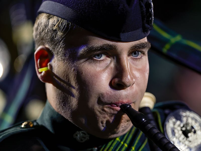 A piper plays at the preview of the Tattoo.