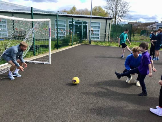 Coleraine captain Lyndon Kane was among a number of players who visited Sandelford School.