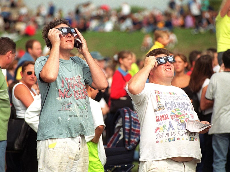 People looking at the eclipse on Southsea Common at the Power in the Dark music event Picture Esme Allen
