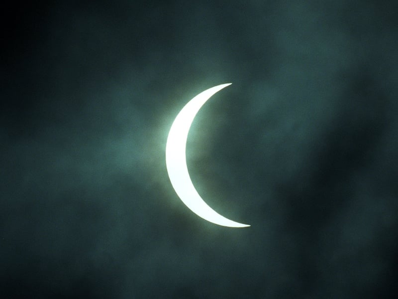 The crescent Sun shines through cloud cover over Leeds as the Moon’s shadow reaches near-total coverage during the 1999 event.