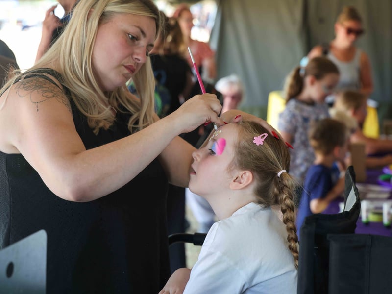 Face painting proves a huge success with younger attendees.