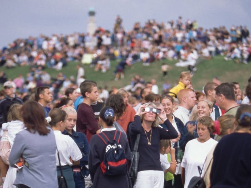 People using their special solar eclipse glasses to look at the sun Picture: Steve Spurgin

