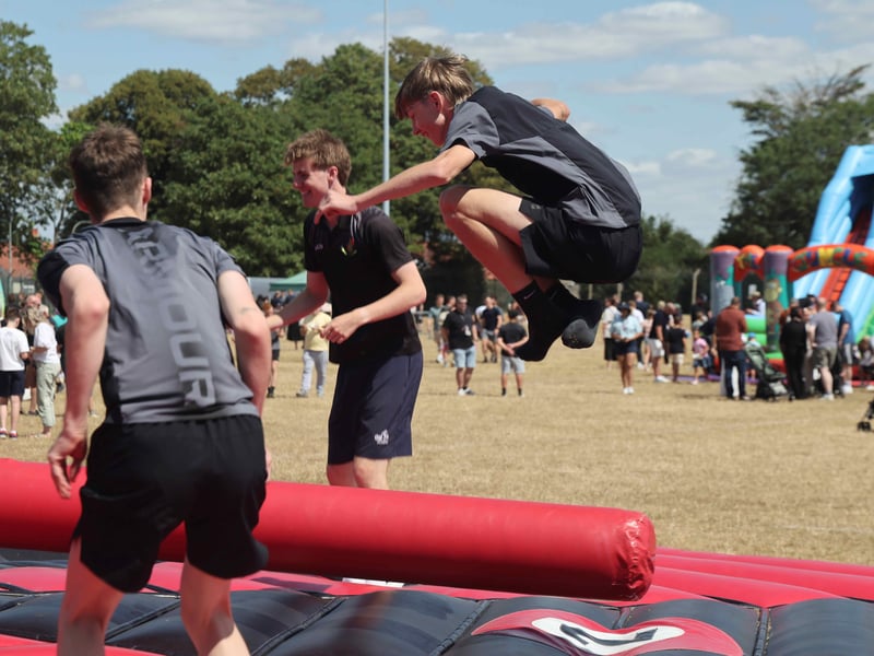 Trainees and families have fun on the inflatables.