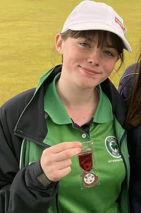 Lurgan bowler, Mia Patterson proudly displaying her runners-up medal that she won in the 2022 U25 Ladies Pairs British Isles Bowls Champions in Wales last week.