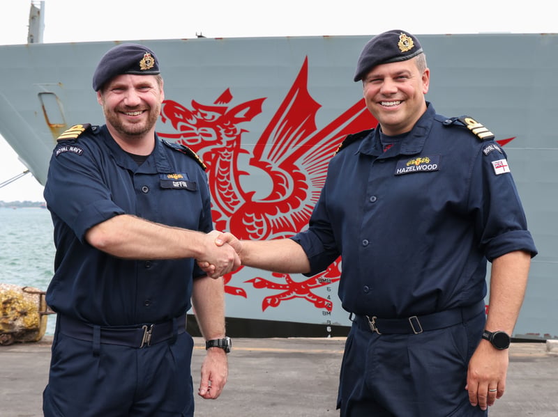 Commander Giffin hands over the role of Commanding Officer to Commander Graeme Hazelwood in Mombasa, Kenya.