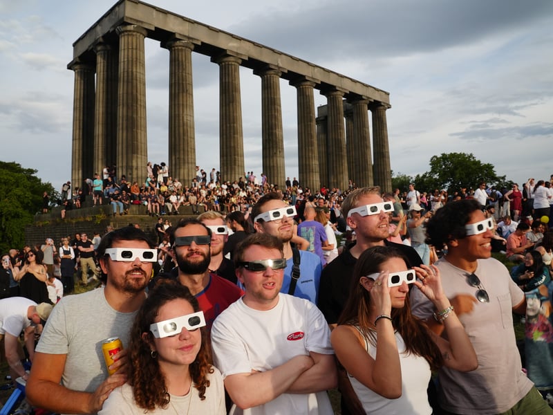 Hundreds gathered for the once-in-a-generation chance to watch the sun slowly disappear behind the moon