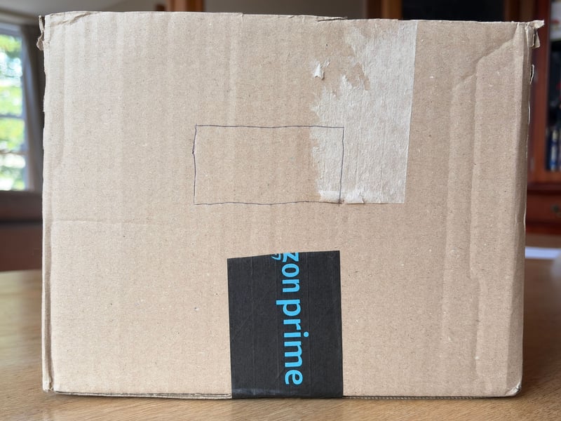 Using a pen or pencil, draw a rectangle on the short side of your box — it doesn’t need to be too large. 
