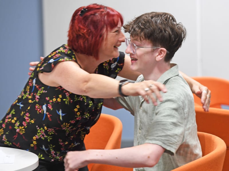 Jacob Jones celebrates his 4 A*s with his family.