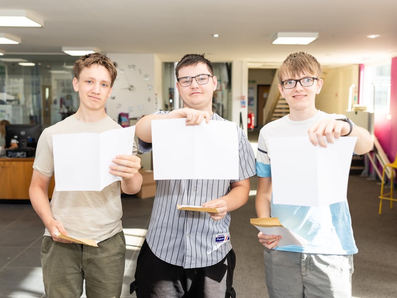 Evan smith, William Elkington and Sam Rogers collect their results at HSDC.