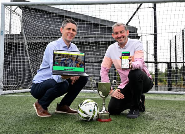 Sam Gamble, Tournament Co-ordinator of the Budget Energy SuperCupNI and Ryan Young, Creative Partner at Astutely, are pictured launching the Budget Energy SuperCupNI website.