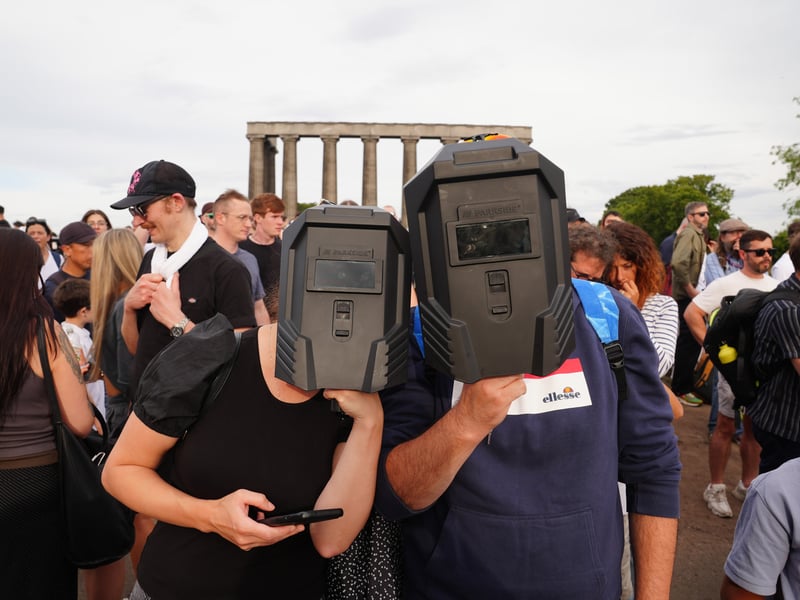 Well-equipped eclipse hunters on Calton Hill.
