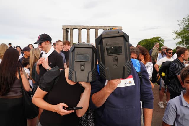 Well-equipped eclipse hunters on Calton Hill.