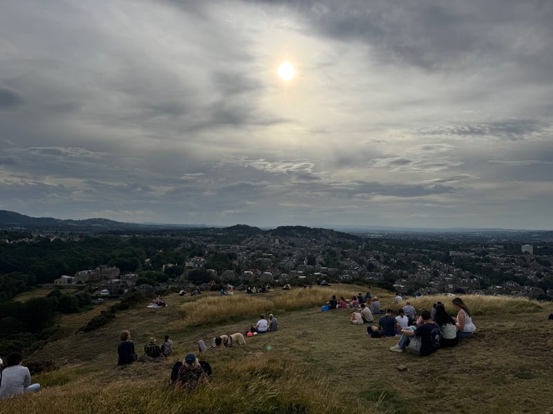 Crowds gather at Blackford Hill to try and catch the solar eclipse.