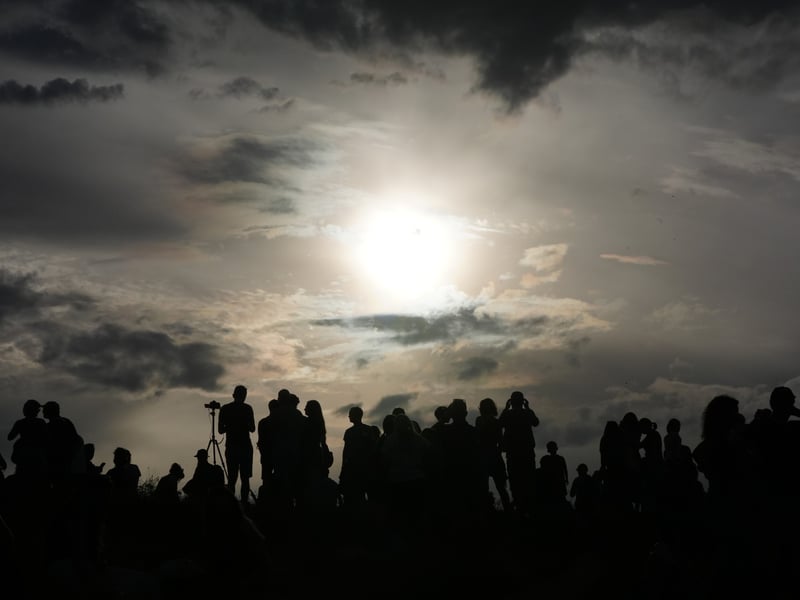 The solar eclipse begins on Calton Hill.