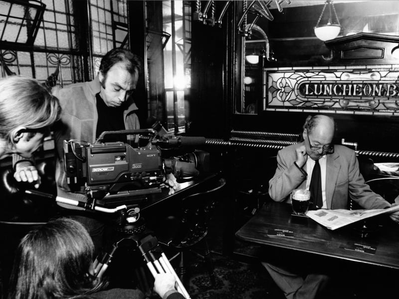 A film crew inside Leeds' historic Whitelocks pub, in October 1991
