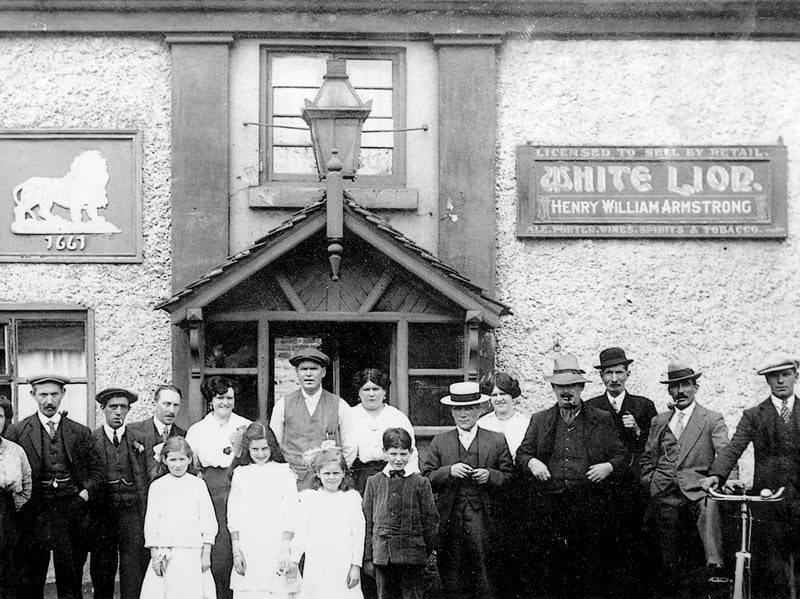 The White Lion at Ketley in a photo which may date from the early 20th century. In any event, it's during the time one Henry William Armstrong was licensee. The facade bore the date 1661. The pub closed around 2017 and, to some local disgust, was knocked down and replaced by a small Sainsbury's supermarket, which has paid homage to the former pub by incorporating a version of the lion sign and date on its frontage