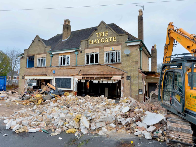 The Haygate on Haygate Road in Wellington was a large pub well known as a live music venue. But it became dormant after the proprietors moved to France. Here it is being demolished in January 2019. The site has been redeveloped. The Haygate played host to thousands of bands from all over the world, and built up a reputation as a place for young and emerging rock bands to grow their fanbases and connect with other musicians. Among events held there was a punk and ska festival, and the pub had also hosted an indie festival. The pub seems to have dated back to the 1930s or perhaps late 1920s - it was certainly in existence by 1939.